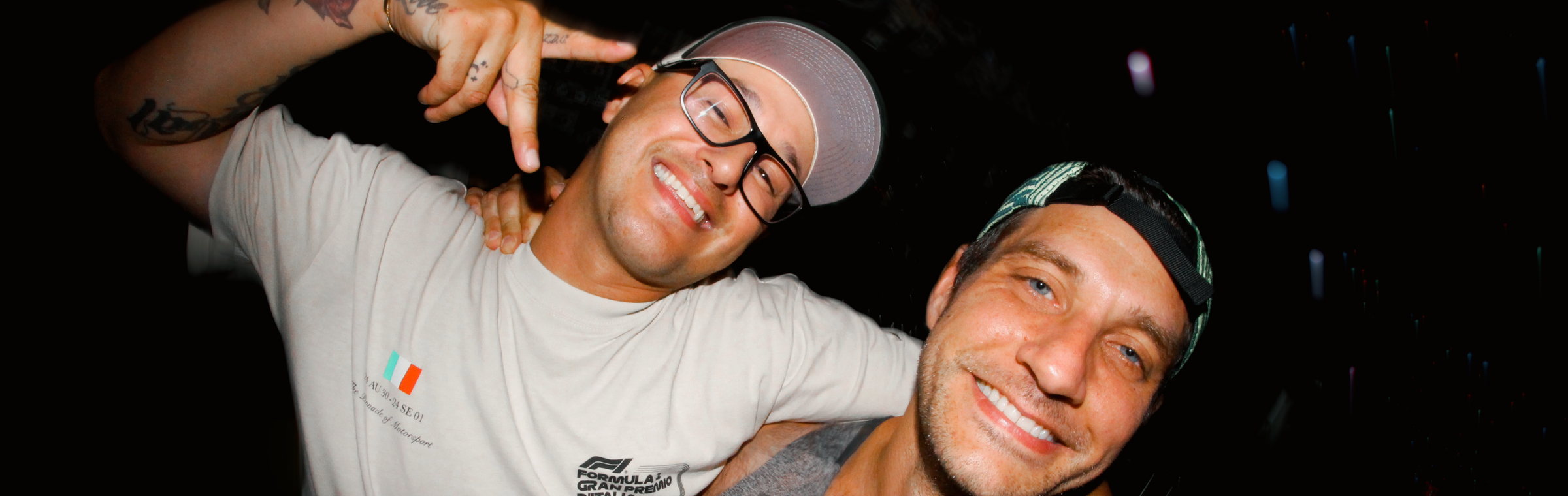 Two guests photographed on flash at an event